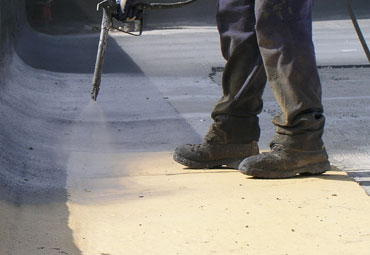 Coating systems over Irving spray foam roof systems